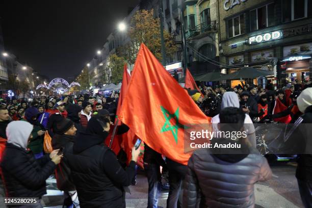 Moroccans living in Brussels celebrate after Morocco advanced to the last 16 of the World Cup following the FIFA World Cup Qatar Group F match...