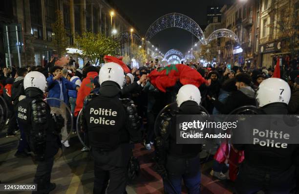 Moroccans living in Brussels celebrate after Morocco advanced to the last 16 of the World Cup following the FIFA World Cup Qatar Group F match...