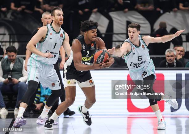 Zach LeDay of Partizan in Victor Claver and Xabi Lopez-Arostegui of Valencia during the 2022/2023 Turkish Airlines EuroLeague match between Partizan...