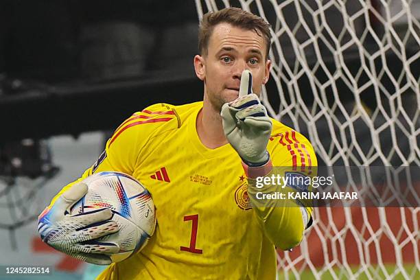 Germany's goalkeeper Manuel Neuer reacts after saving a shot during the Qatar 2022 World Cup Group E football match between Costa Rica and Germany at...