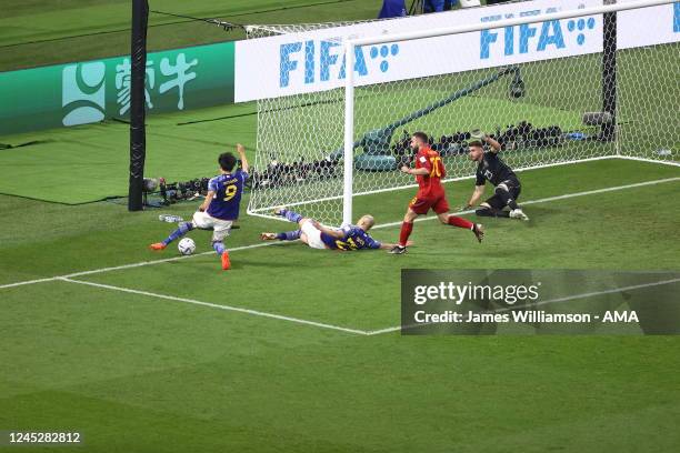 Kaoru Mitoma of Japan keeps the ball in play and crosses to Ao Tanaka of Japan who scores a goal to make it 2-1 during the FIFA World Cup Qatar 2022...