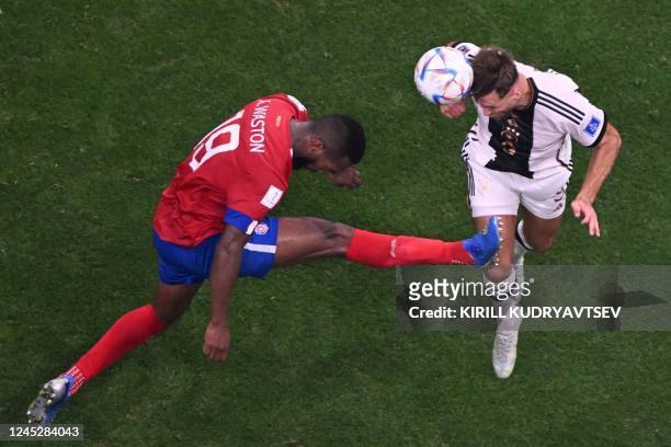 Costa Rica's defender Kendall Waston and Germany's forward Niclas Fuellkrug fight for the ball during the Qatar 2022 World Cup Group E football match...