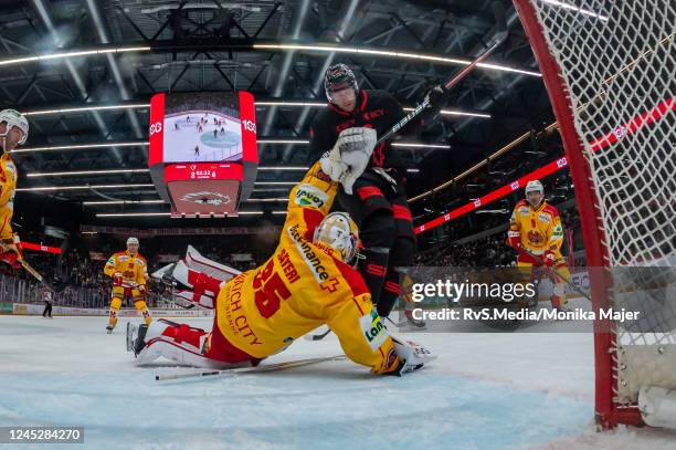 Jiri Sekac of Lausanne HC clashes with Goalie Harri Sateri of EHC Biel during the Swiss National League game between Lausanne HC and EHC Biel-Bienne...