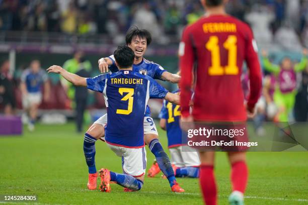 Shogo Taniguchi of Japan and Kaoru Mitoma of Japan celebrate after winning the FIFA World Cup Qatar 2022 Group E match between Japan and Spain at...