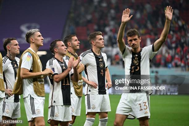Germany's players gesture to fans at the end of the Qatar 2022 World Cup Group E football match between Costa Rica and Germany at the Al-Bayt Stadium...