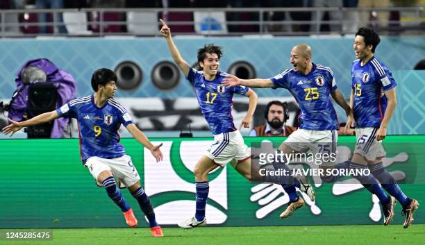 Japan's midfielder Ao Tanaka celebrates scoring his team's second goal during the Qatar 2022 World Cup Group E football match between Japan and Spain...