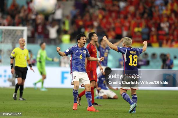 Wataru Endo of Japan and Takuma Asano celebrate victory during the FIFA World Cup Qatar 2022 Group E match between Japan and Spain at Khalifa...