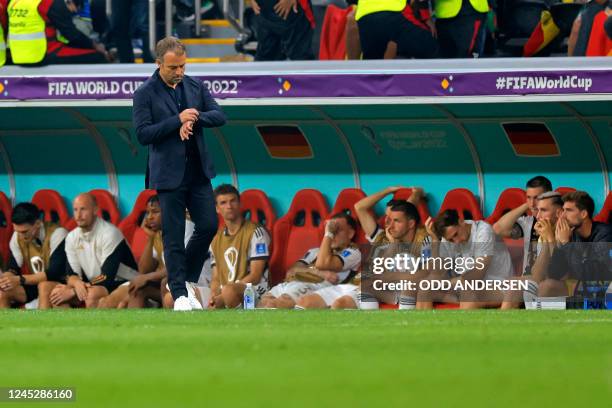 Germany's coach Hans-Dieter Flick looks at his watch during the Qatar 2022 World Cup Group E football match between Costa Rica and Germany at the...