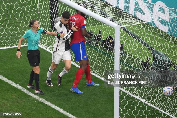 French referee Stephanie Frappart intervenes as Costa Rica's defender Kendall Waston argues with Germany's midfielder Kai Havertz, who scored his...