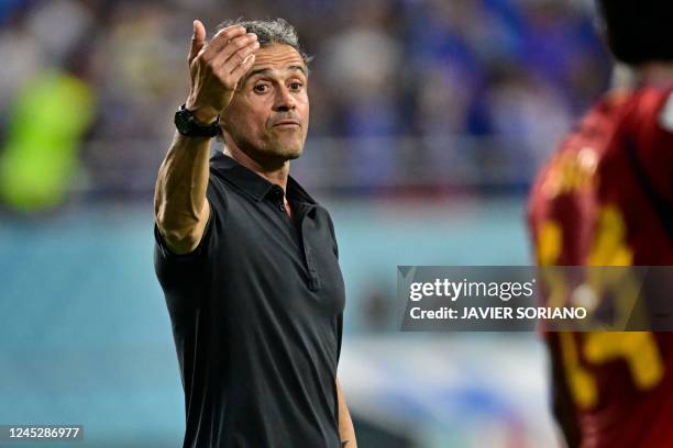 Spain's coach Luis Enrique reacduring the Qatar 2022 World Cup Group E football match between Japan and Spain at the Khalifa International Stadium in...