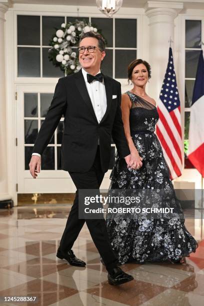 Comedian Stephen Colbert and his wife Evelyn McGee-Colbert arrives at the White House to attend a state dinner honoring French President Emmanuel...