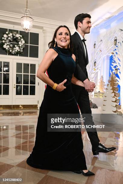 Actress Julia Louis-Dreyfus and her son Charles Hall arrive at the White House to attend a state dinner honoring French President Emmanuel Macron, in...