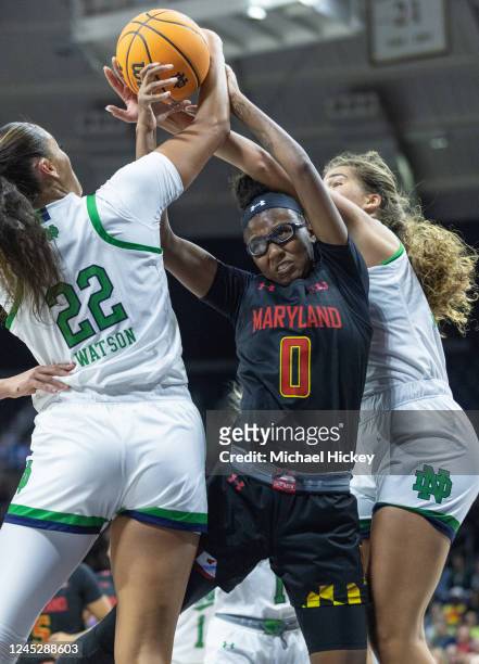 Shyanne Sellers of the Maryland Terrapins gets tied up in rebounding the ball with Kylee Watson of the Notre Dame Fighting Irish during the first...