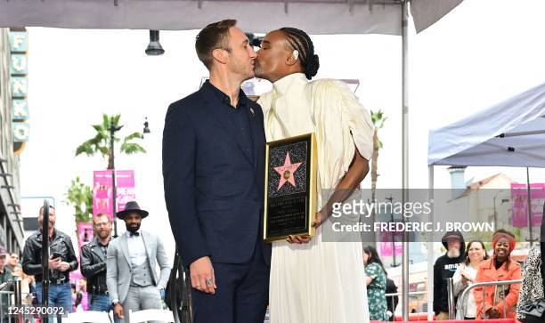 Actor Billy Porter and husband Adam Smith kiss on Porter's newly unveiled Hollywood Walk of Fame star in Hollywood, California, on December 1, 2022.