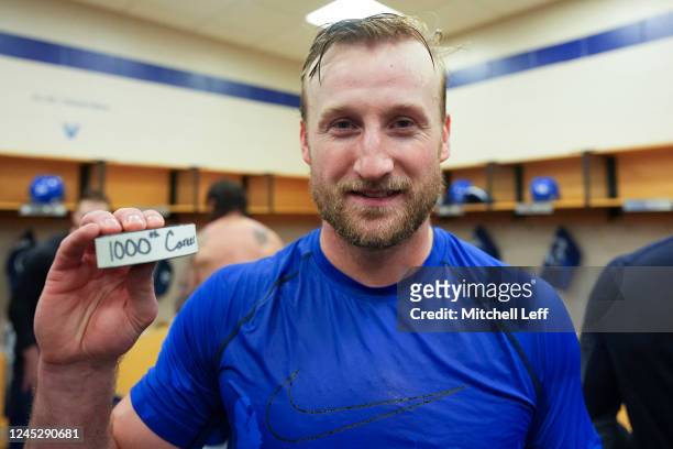 Steven Stamkos of the Tampa Bay Lightning poses for a picture with his 1000th career NHL point puck against the Philadelphia Flyers at the Wells...