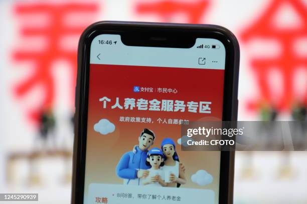 Mobile phone displays the private pension scheme interface in Shenzhen, Guangdong province, China, Dec 2, 2022. The China Banking and Insurance...