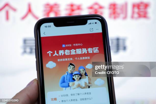 Mobile phone displays the private pension scheme interface in Shenzhen, Guangdong province, China, Dec 2, 2022. The China Banking and Insurance...