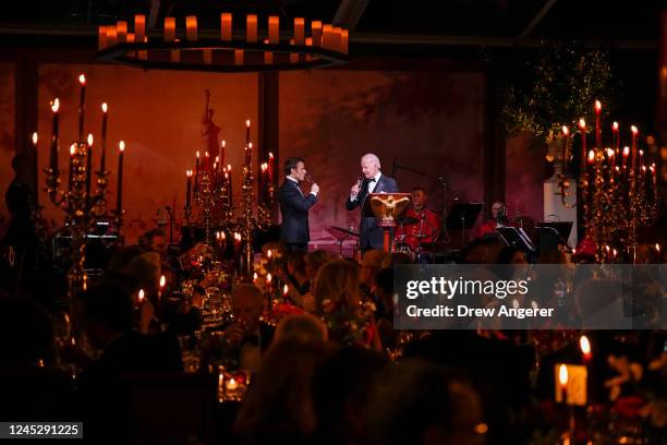 President Joe Biden and French President Emmanuel Macron share a toast after speaking at the state dinner on the South Lawn of the White House on...