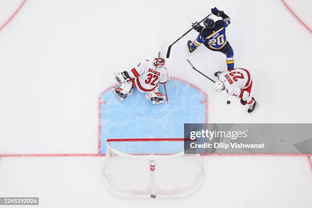 Antti Raanta and Antti Raanta of the Carolina Hurricanes defend the goal against Brandon Saad of the St. Louis Blues in the second period at...