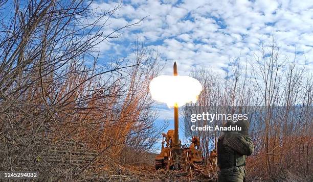 Armed members of the self-proclaimed Donetsk People's Republic fire howitzer on Bakhmut border front in Donetsk, Ukraine on December 1, 2022.