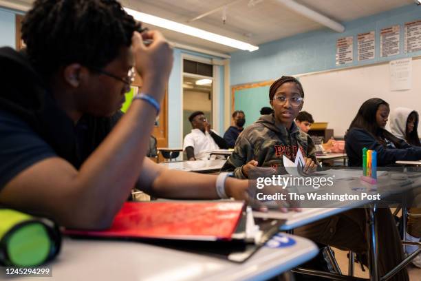 Seniors Jason Boyce, Jr., left, and Trinity Edwards discuss differences between 17th century Africa and the United States during an Advanced...