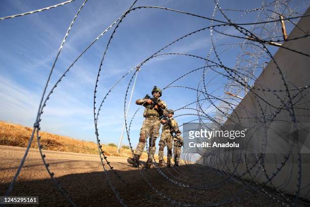 Turkish army members of 1st and 3rd Border Regiment Commands guard the border near Gaziantep, Turkiye on November 20, 2022. With weapons, gear, and...