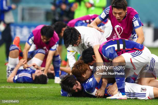 Team Japan celebrates during the World Cup match between Japan v Spain , in Doha, Qatar, on December 1 , 2022. NO USE POLAND