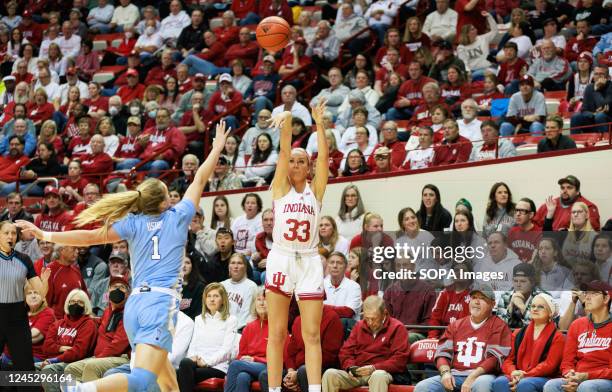 Indiana Hoosiers guard Sydney Parrish shoots a three-point against North Carolina Tar Heels guard Alyssa Ustby during an NCAA women's basketball game...