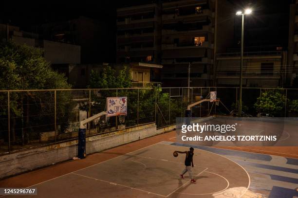 Prince Kuworde is training at a basketball court in Athens on October 16, 2022. - In the shadow of Giannis Antetokounmpo, world basketball star from...