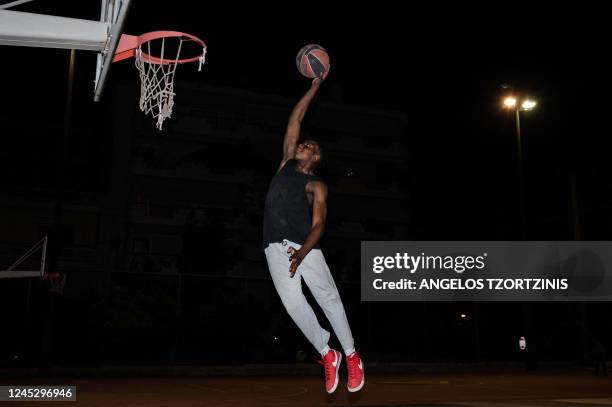 Prince Kuworde trains at a basketball court in Athens on October 16, 2022. - In the shadow of Giannis Antetokounmpo, world basketball star from...