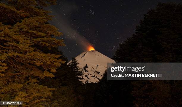 The Villarrica volcano shows signs of activity, as seen from Pucon, some 800 kilometers south of Santiago, on December 1, 2022. - Villarrica volcano...