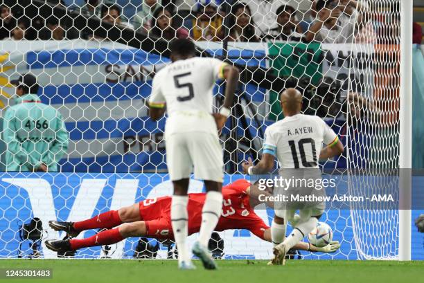 Sergio Rochet of Uruguay saves a penalty from André Ayew of Ghana during the FIFA World Cup Qatar 2022 Group H match between Ghana and Uruguay at Al...