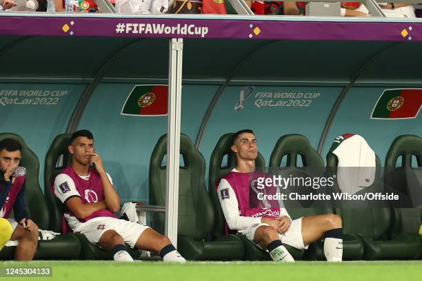 Cristiano Ronaldo of Portugal sitting on the bench having been replaced during the FIFA World Cup Qatar 2022 Group H match between Korea Republic and...