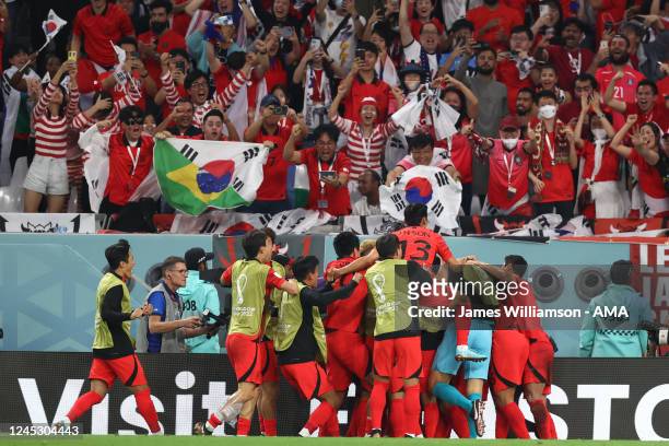 Hwang Hee-Chan of Korea Republic celebrates after scoring a goal to make it 2-1 during the FIFA World Cup Qatar 2022 Group H match between Korea...