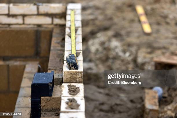 Tape measure on a half built wall on a Bellway Plc residential construction site in Bacton, UK, on Friday, Dec. 2, 2022. More than half of Britons...