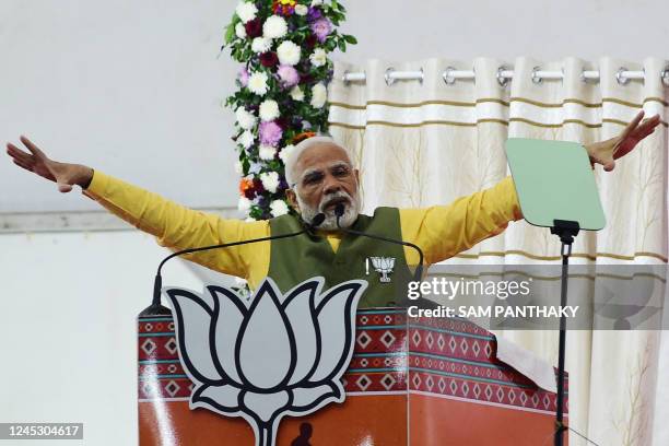 Indian Prime Minister Narendra Modi gestures as he speaks during a Bhartiya Janta Party rally ahead of 2nd phase of Gujarat's assembly election, in...