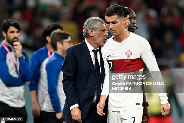 Portugal's coach Fernando Santos greets Portugal's forward Cristiano Ronaldo as he leaves the pitch during the Qatar 2022 World Cup Group H football...