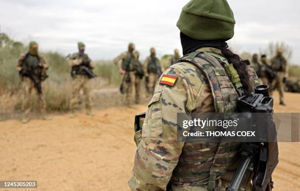 Spanish military instructor trains a group of Ukrainian soldiers in the Spanish army base of Toledo, on December 2, 2022. - Spanish military...