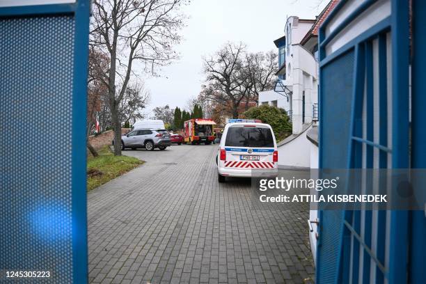 Local fire engine and police car are seen with some diplomatic cars in front of Ukraine's embassy in Budapest on December 02 after a bloody package...