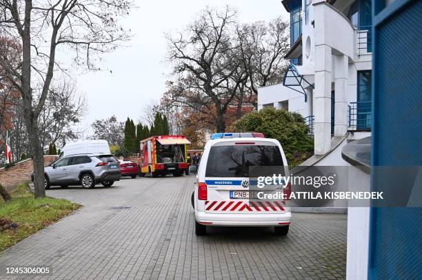 Local fire engine and police car are seen with some diplomatic cars in front of Ukraine's embassy in Budapest on December 02 after a bloody package...