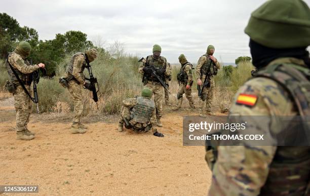 Spanish military instructor trains a group of Ukrainian soldiers in the Spanish army base of Toledo, on December 2, 2022. - Spanish military...