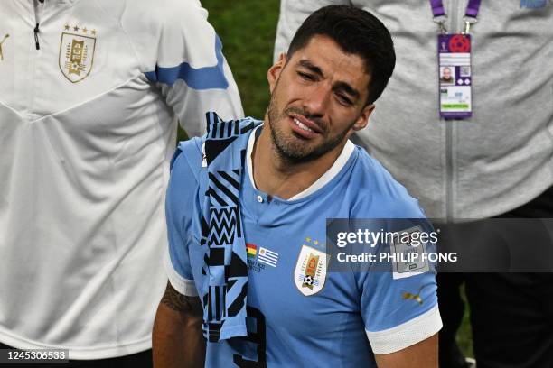 Uruguay's forward Luis Suarez reacts at the end of the Qatar 2022 World Cup Group H football match between Ghana and Uruguay at the Al-Janoub Stadium...