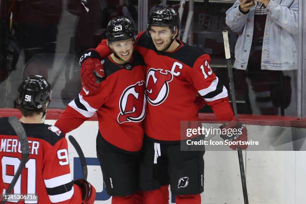 New Jersey Devils left wing Jesper Bratt celebrates with New Jersey Devils center Nico Hischier after scoring a goal during the National Hockey...