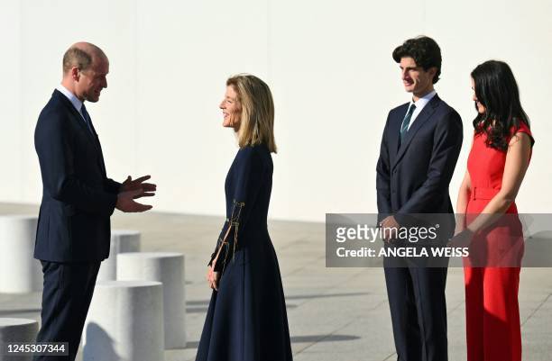 Britain's Prince William, Prince of Wales, is welcomed by US Ambassador to Australia, Caroline Kennedy , Jack Kennedy Schlossberg and Tatiana Kennedy...