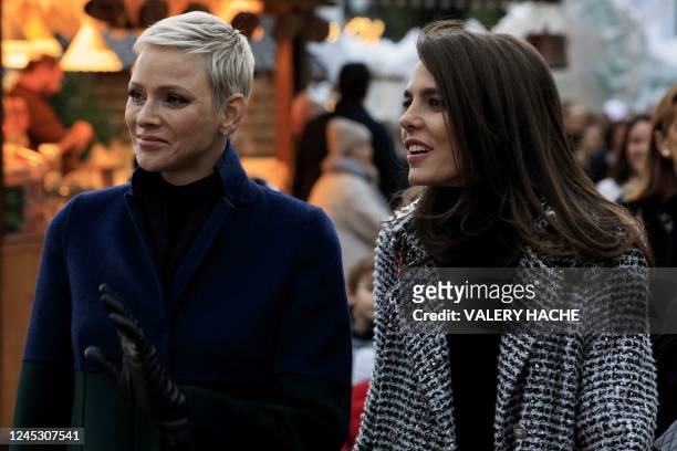 Princess Charlene of Monaco and Charlotte Casiraghi inaugurate the Christmas village in Monaco, on December 2, 2022.