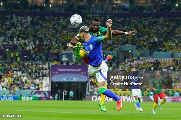 Antony right winger of Brazil and Manchester United and Nouhou Tolo left-back of Cameroon and Seattle Sounders FC compete for the ball during the...