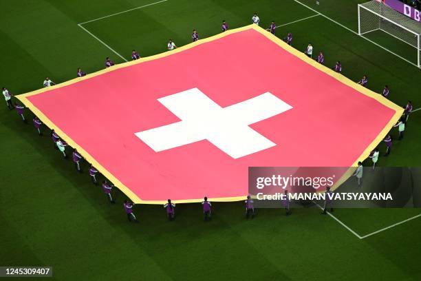 The flag of Switzerland is displayed during the presentation ahead of the Qatar 2022 World Cup Group G football match between Serbia and Switzerland...