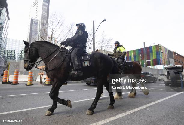 Mounted police patrol outside the Palais des Congres ahead of the COP15 UN Biodiversity Conference in Montreal, Quebec, Canada, on Friday, Dec. 2,...