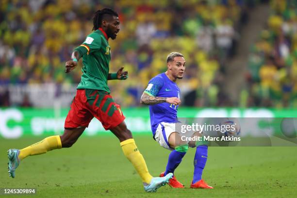 Antony of Brazil in action with Andre-Frank Zambo Anguissa of Cameroon during the FIFA World Cup Qatar 2022 Group G match between Cameroon and Brazil...