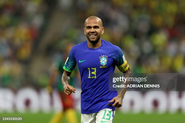 Brazil's defender Dani Alves reacts during the Qatar 2022 World Cup Group G football match between Cameroon and Brazil at the Lusail Stadium in...